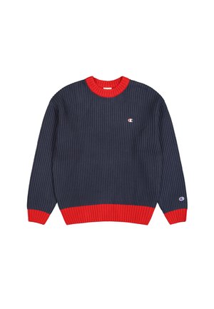 Marineblauwe geribbelde sweater met een contrasterende rode ronde hals en zoom. Geheel voorzien van een logo patch op de borst en met opgerolde mouwen.