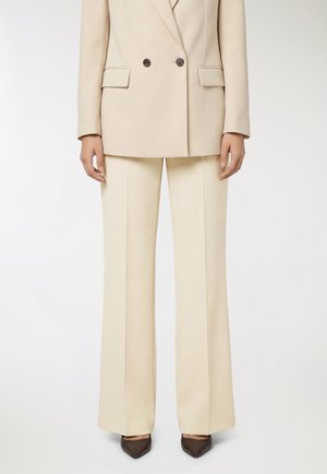 - Spodnie materiałowe