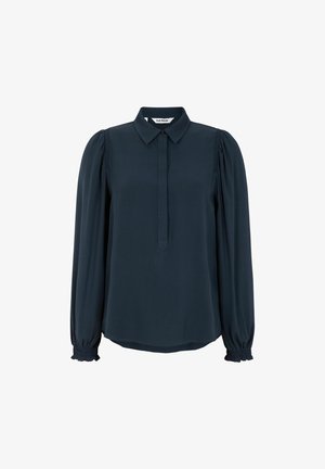 Tumedat bluus, millel on terav krae, pikad puffvarrukad ja nööpidega esikülg. Pehme, siledatest kangast, varrukatel on kogumise detail.