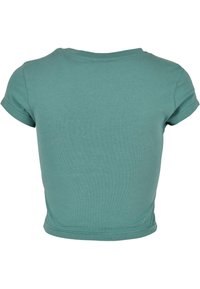 En enfärgad kortärmad teal crop top sett bakifrån med rund halsringning och vikta fållar på ärmarna.