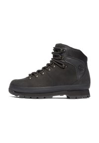 Scarpe da trekking in pelle nera con un colletto in tessuto testurizzato, occhielli in metallo e una suola in gomma robusta con un motivo di trazione.