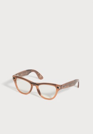 Transparent brown plastic framed Ray-Ban eyeglasses with clear lenses and subtle black camera lenses on outer edges.