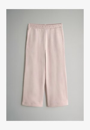 Világos rózsaszín, bő szárú nadrág, elasztikus derékkal. Sima textúra, rövidített hossz, nincsenek látható zsebek vagy díszítések.