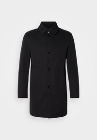 Cappotto nero con taglio dritto, colletto, chiusura a cinque bottoni e una consistenza del tessuto liscia. Maniche lunghe e design fino al ginocchio.