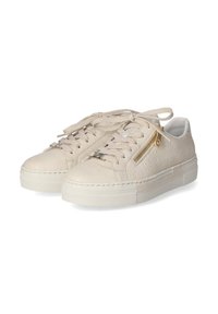 Beige leather sneakers with textured side panel, flat shoestrings, gold zip detail, and a rubber sole. Smooth finish and rounded toe.