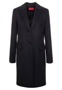 Svart enknäppt yllekappa med slag, två knappar, ficklock och en röd inre etikett.