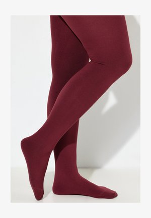 Collant opachi bordeaux con una texture liscia, vestibilità aderente e senza motivi visibili. Il design presenta una punta senza cuciture e supporto per la caviglia.