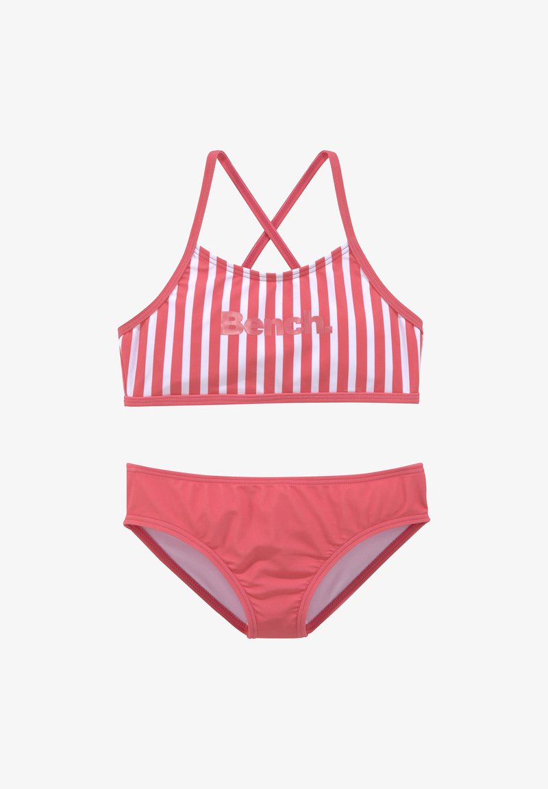 Coral pink bikini set with white vertical stripes. The top features crisscross straps and a centered "Bench." logo. Soft, stretchy material.