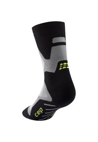 Calzini neri alla caviglia con motivi geometrici grigi e accenti giallo neon. Realizzati in un materiale elastico per flessibilità e comfort.