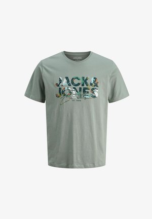 Light green cotton t-shirt featuring "JACK & JONES" in a multi-colored floral print. Classic crew neckline and short sleeves.