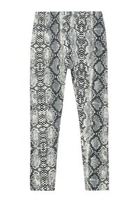 Schwarz-weiße Schlangenprint-Leggings aus dehnbarem Stoff. Sie verfügen über eine glatte Textur und einen figurschmeichelnden Schnitt.