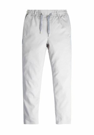 Lichtgrijze trainingbroek met een elastische tailleband, trekkoordsluiting en zijzakken. Glad stofafwerking, taps toelopend ontwerp van de pijpen.
