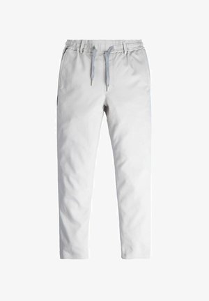 Hellgraue Sweatpants mit elastischem Bund, Zugbandverschluss und Seitentaschen. Glatte Stoffoberfläche, schmal zulaufendes Bein-design.