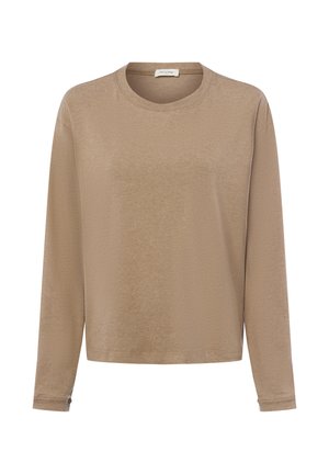 Pikendusvarrukatega beež topp, mis on valmistatud pehmest kangast. Omab ümmargust kaelust, lõdva istuvuse ja mansette randmetel. Sile tekstuur ja minimaalne detailide kasutus.