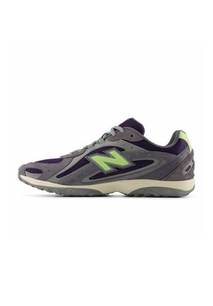 Grey and purple athletic shoe with green "N" logo on the side, mesh and suede upper, and grey rubber sole.