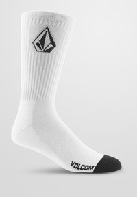 Weiße Baumwoll-Crewsocke mit geripptem Muster, schwarzer Zehenkappe und einem schwarzen Diamant-Logo nahe der Oberseite. "VOLCOM" auf der Sohle gedruckt.