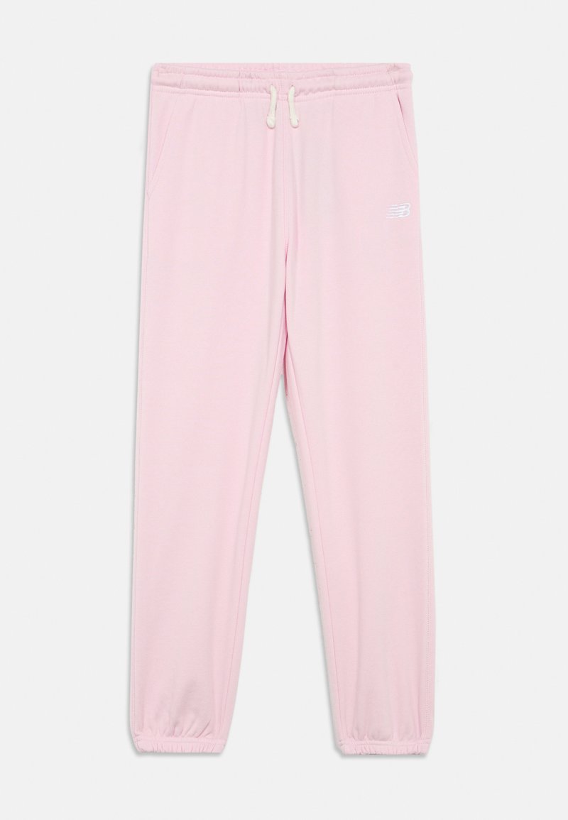 Svetlo roza trenirke z elastičnimi manšeti in pasom, belim vrvico, stranskimi žepi in majhnim belim logotipom na desnem stegnu.