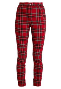 Pantaloni a motivo check rosso, caratterizzati da una vestibilità aderente, distintivi check in bianco e nero, zip laterali e una trama del tessuto liscia.