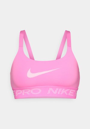 Soutien-gorge de sport rose en tissu lisse avec des bretelles ajustables fines. Présente un logo Nike blanc et une bande élastique avec le texte "PRO NIKE".