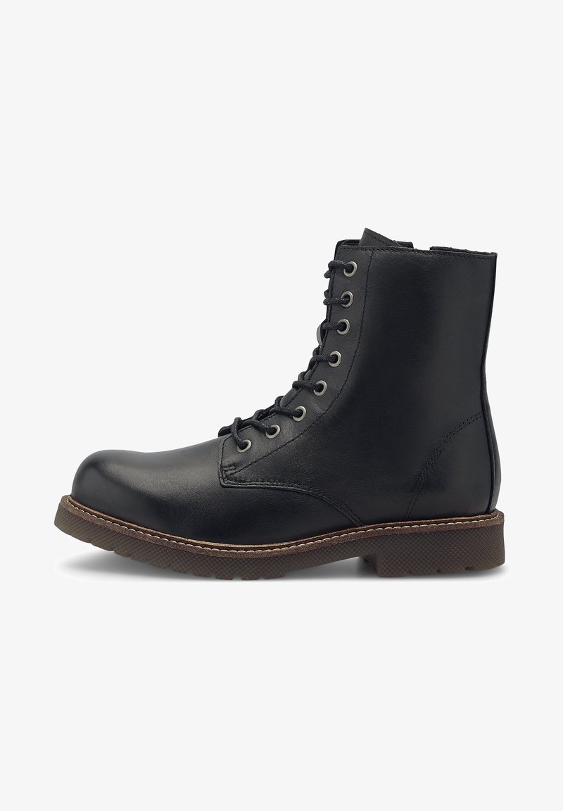 Bottine en cuir noir avec semelle cousue marron, fermeture éclair à l'avant et bout rond, présentée en profil latéral sur fond blanc.