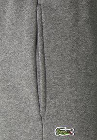 Lacoste Treniņtērpa apakšdaļas - pitch chine