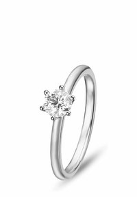 Silberner metallischer Ring mit einem runden, brillant geschliffenen Diamanten in einer sechszackigen Fassung. Glatter Ring mit polierter Oberfläche.