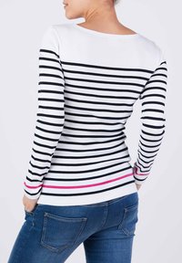 Langärmliges Hemd mit schwarz-weißen horizontalen Streifen und einem rosa Akzent am Saum. Hergestellt aus weichem, dehnbarem Stoff.