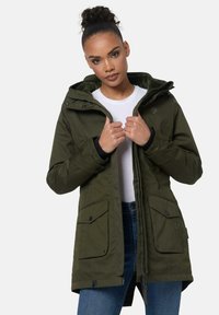 Olive green parka jacket with a zip and snap front, adjustable hood, and two front pockets. Features a textured fabric and contrasting black cuffs.
