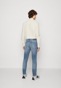 Scotch & Soda SEASONAL ESSENTIALS SKIM - Slim fit jeans - blue denim ...