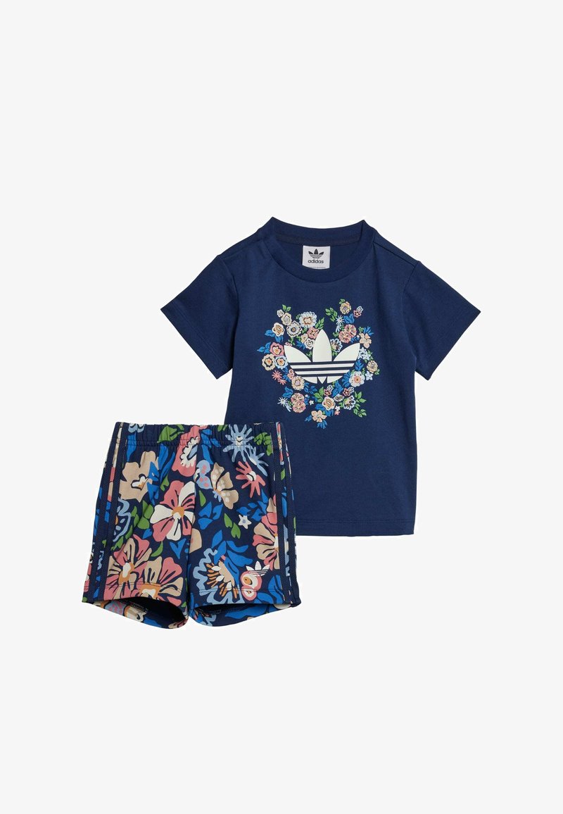 Navy blue t-shirt with floral graphic design and white adidas logo, paired with multicolored floral print shorts, elastic waistband.