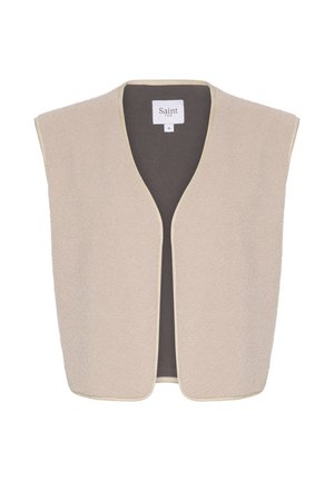 Gilet beige senza maniche realizzato in morbido fleece con un ampio scollo a V. L'interno è di un tessuto più scuro, rifinito con un bordo a contrasto.