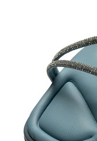 Blue leather sandal with a triangular toe design, featuring sparkling silver straps for accent. Smooth texture with a padded footbed.
