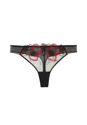 String noir en dentelle transparente avec des cœurs rouges brodés et des motifs floraux sur la ceinture avant.