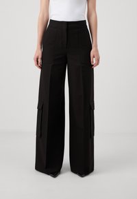 HUGO HIMANA - Pantalon cargo - black