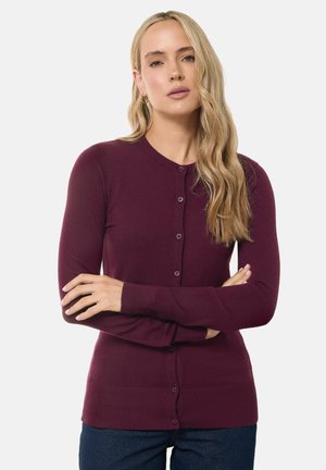 Bordeauxrode cardigan met een ronde halslijn en een knopenfrontsluiting. Lange mouwen, geribde manchetten en zoom. Zachte textuur en aansluitend ontwerp.