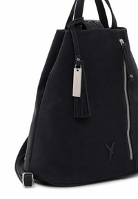 Black textured fabric bag with a tapered shape, side zipper, and a tassel accent. Includes adjustable strap and metal hardware detail.