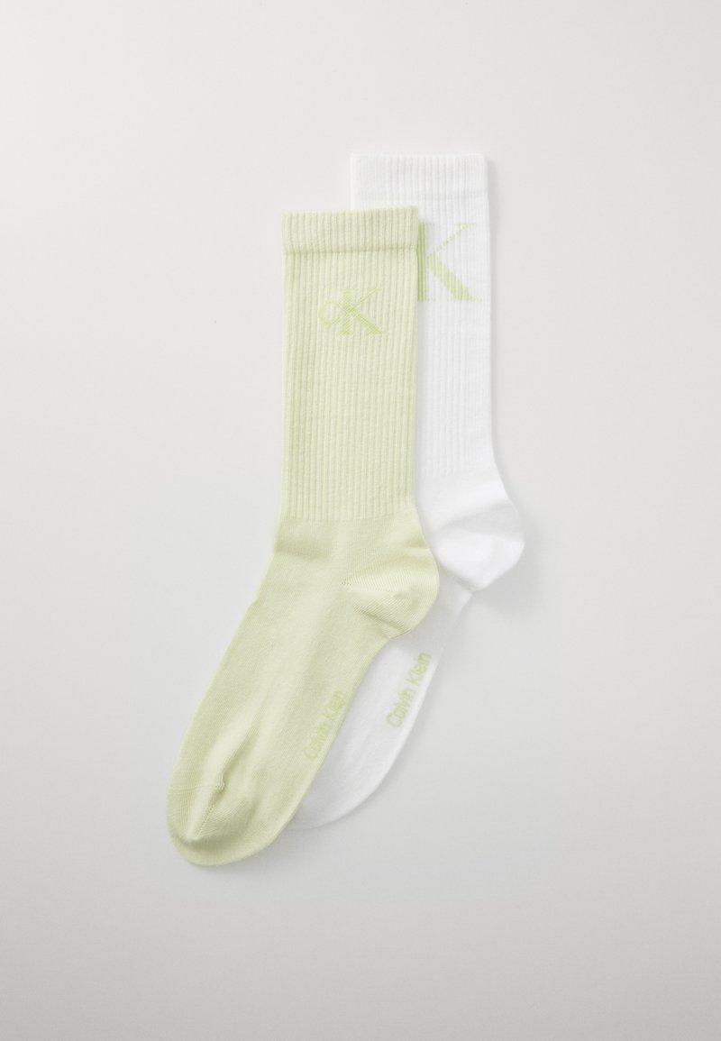 Socken aus Baumwollmischung in Hellgrün und Weiß. Gerippte Textur mit subtiler Markenkennzeichnung; nahtloser Zehenbereich und Knöchelhöhe.