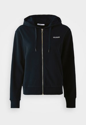 Sort zip-up hættejakke med snore, ribbede manchetter og kant, samt lille hvid "GUESS" logo på venstre bryst.
