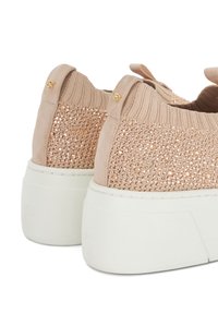 Blush pink sneakers with a textured knit upper and sparkling embellishments, featuring a white platform sole and gold hardware accents.
