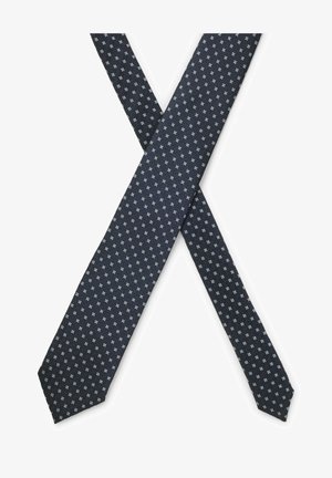 Två mörkblå slipsar korsade, med ett upprepat mönster av små vita och ljusblå rutor.