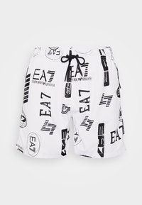 Shorts da nuoto bianchi con loghi e testo grafici neri, cintura elastica con cordino e tessuto liscio e leggero.