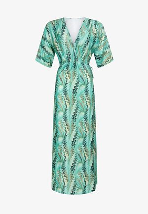Abito lungo avvolgente in verde e beige con motivo a foglie, dotato di scollatura a V profonda, maniche ampie e vita con laccio regolabile.