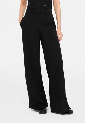 FLARED WITH SLITS - Pantaloni - black
