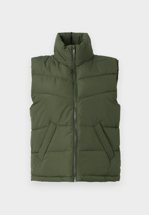 Õlivihroline polsterdatud vest kõrge kraega, ees lukuga ja küljetaskutega. Teemanttikanditud muster lisab tekstuuri ja struktuuri.