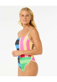 Multikleurige badpak met verticale strepen in roze, blauw, groen en zwart, met dunne witte bandjes en open zijkanten.