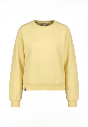 Sweat-shirt à manches longues jaune clair avec col rond, poignets et ourlet côtelés, avec une petite étiquette noire de la marque en bas à gauche.