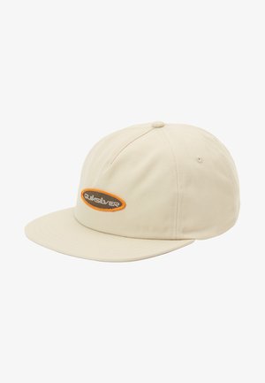 Beige baseball cap with a flat brim. Features a brown and orange embroidered logo on the front. Made of soft fabric with subtle texture.