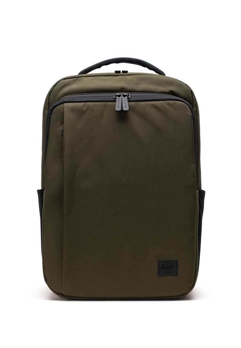 Olivi vihreä kangaskassi, jossa on tyylikäs muotoilu. Siinä on etuzipperi, mustat yksityiskohdat ja kaksoisvetoketjun vetimet.