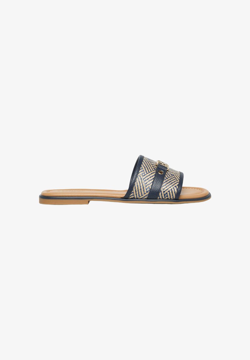Flat open-toe slide sandal with tan sole and navy blue patterned wide strap featuring a gold buckle detail.