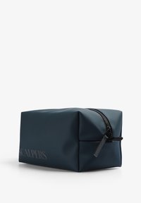 Navy blue rectangular toiletry bag made of smooth synthetic material. Features a black zipper and embossed brand logo on the side.